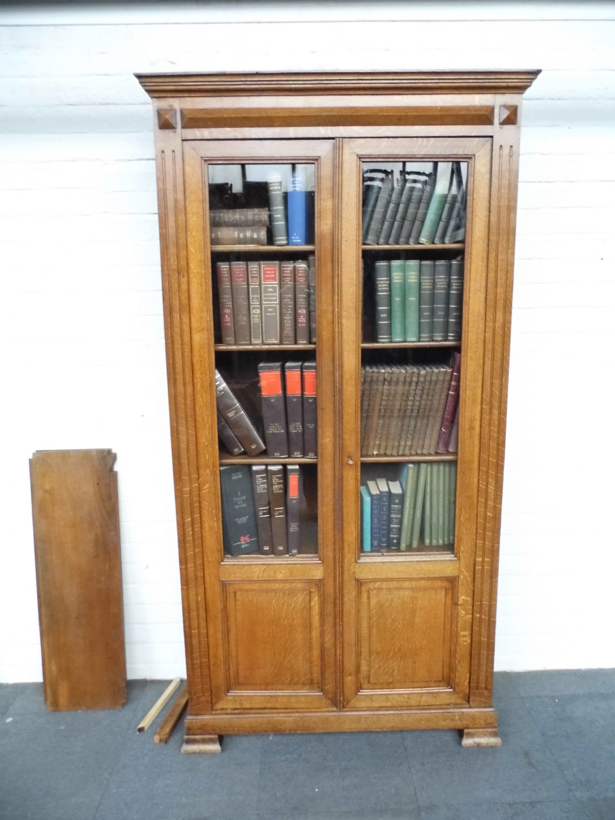 french oak bookcase with glazed doors and panelled doors