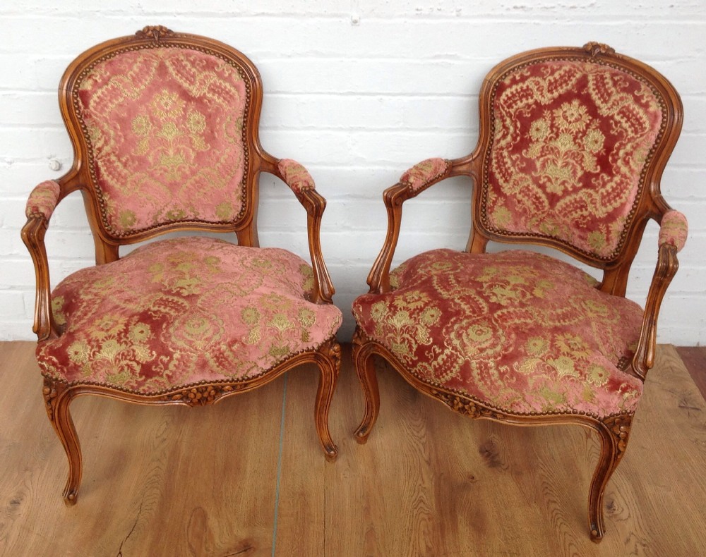 pair of french upholstered louis xv armchairs