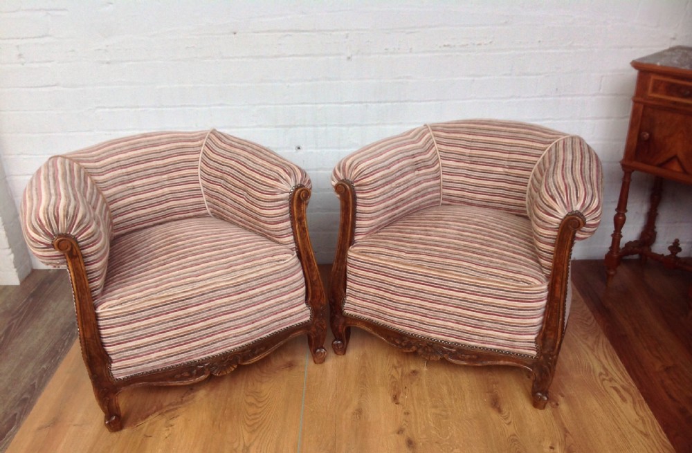 pair of upholstered french louis xv club chairs