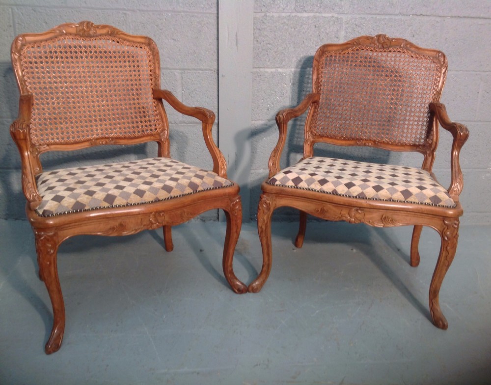 pair of french carved walnut fauteuils