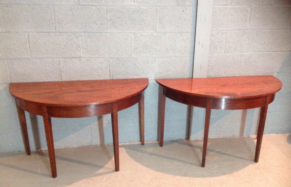 pair of mahogany demi lune console tables