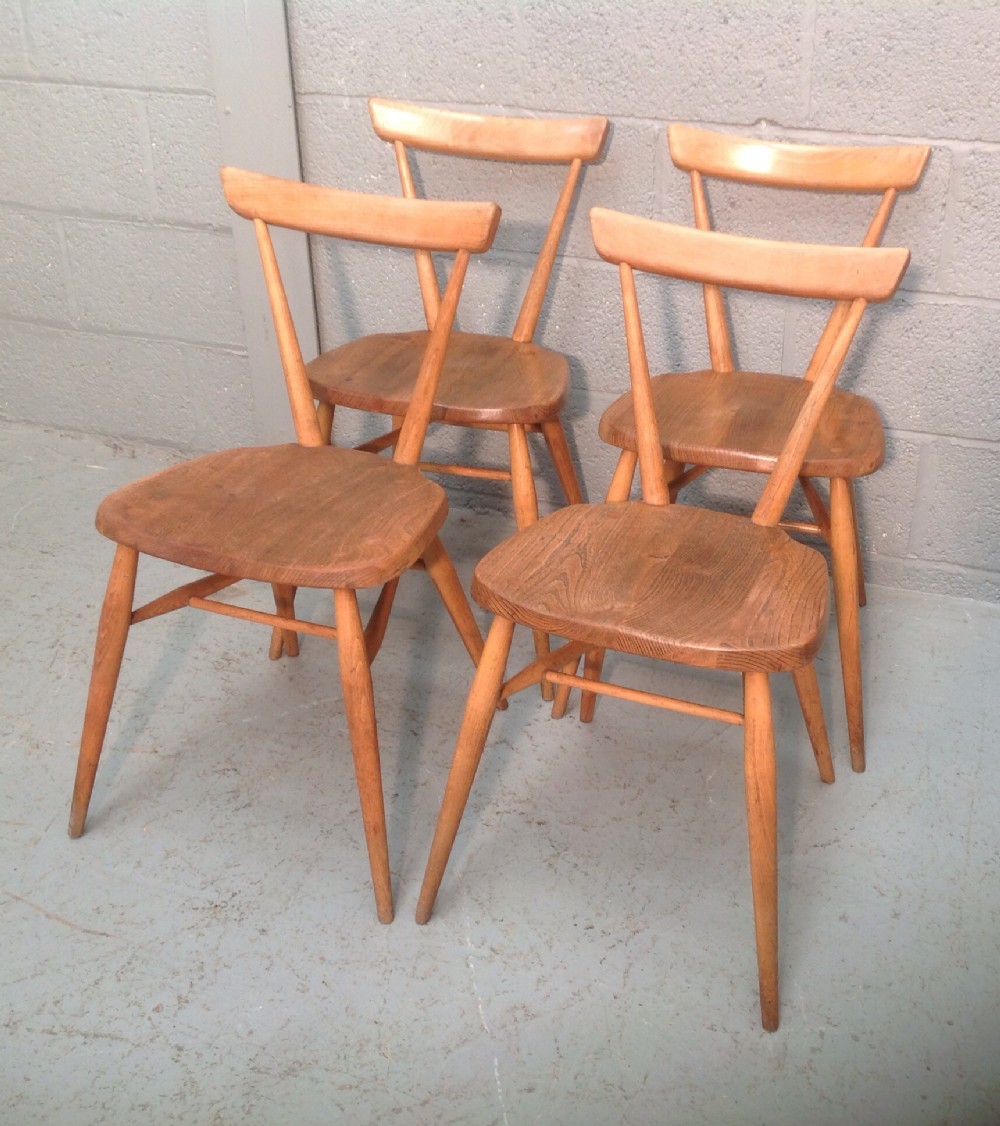 set of four ercol stacking chairs