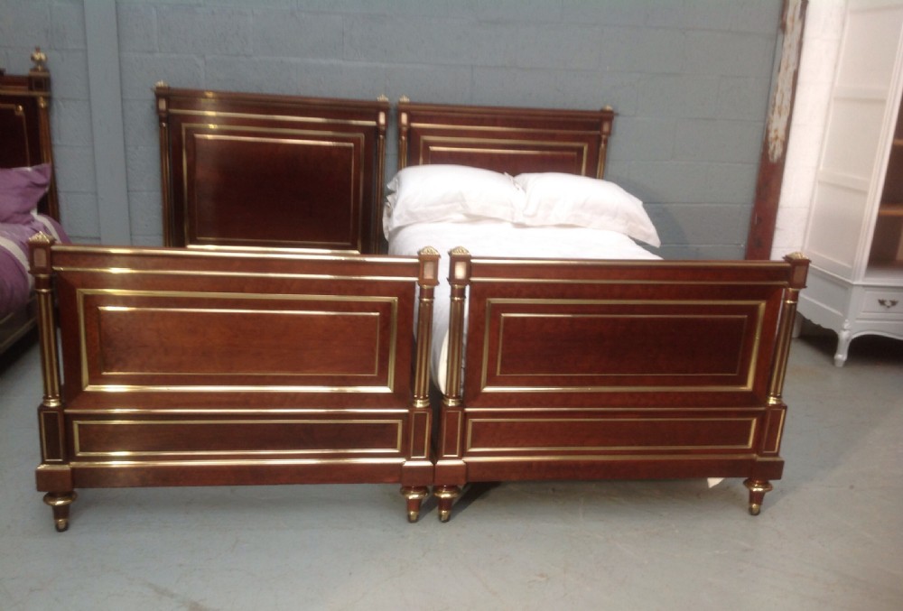 pair of french empire mahogany beds