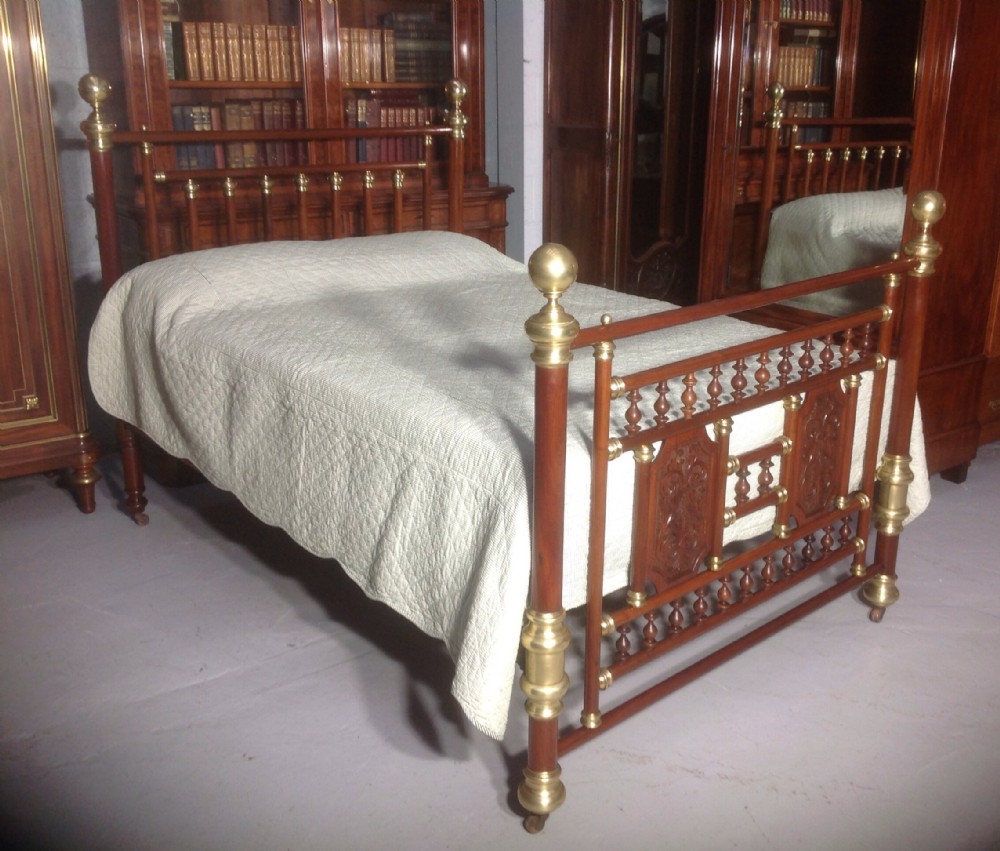 brass and mahogany bed