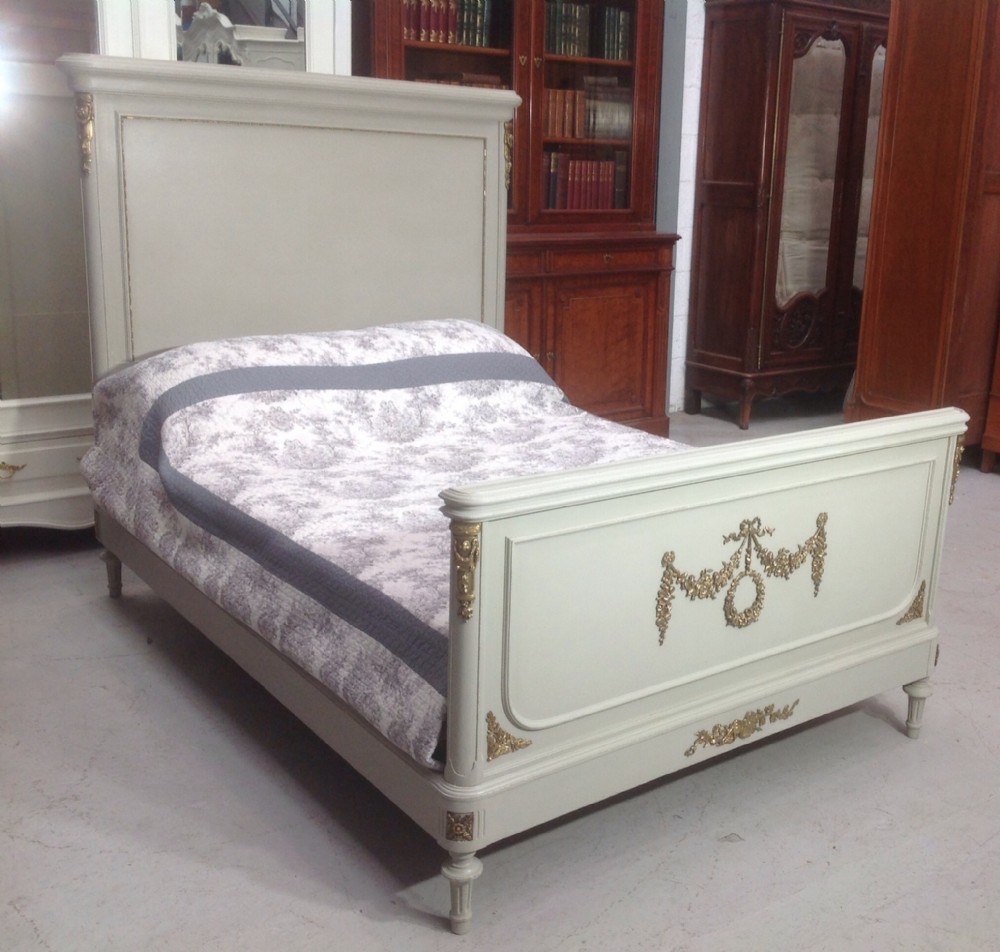 painted french bed with brass detailing
