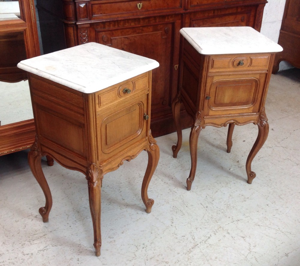pair of light oak french bedside cabinets