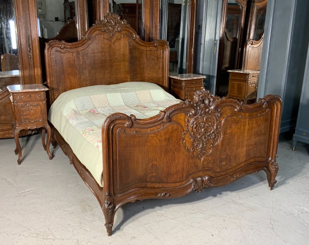 outstanding carved oak super kingsize bed and matching bedside cabinets