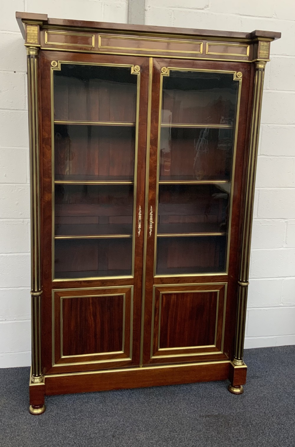 french mahogany and brass directoire bookcase