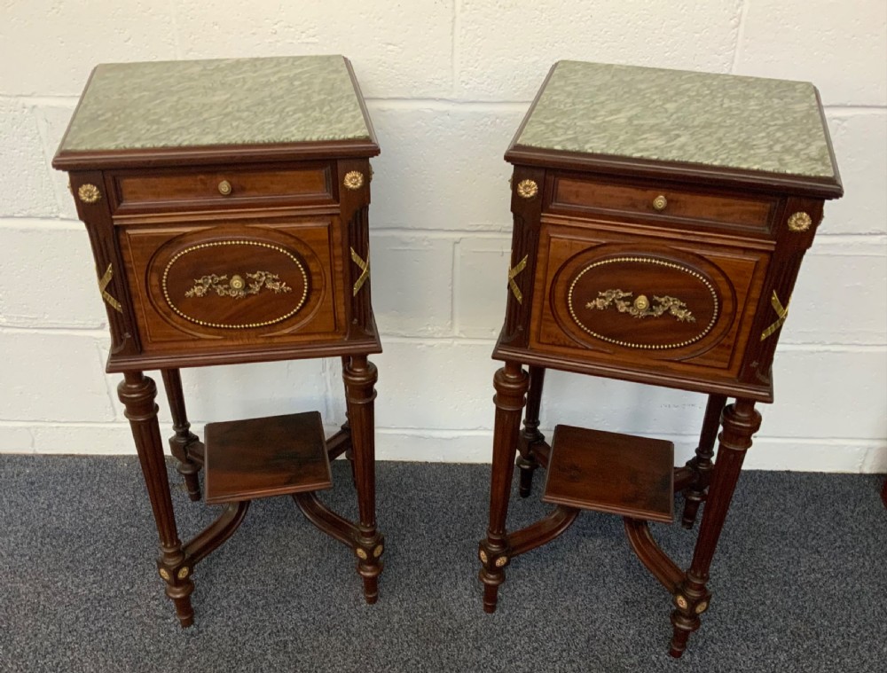 pair of brass and mahogany french bedside cabinets