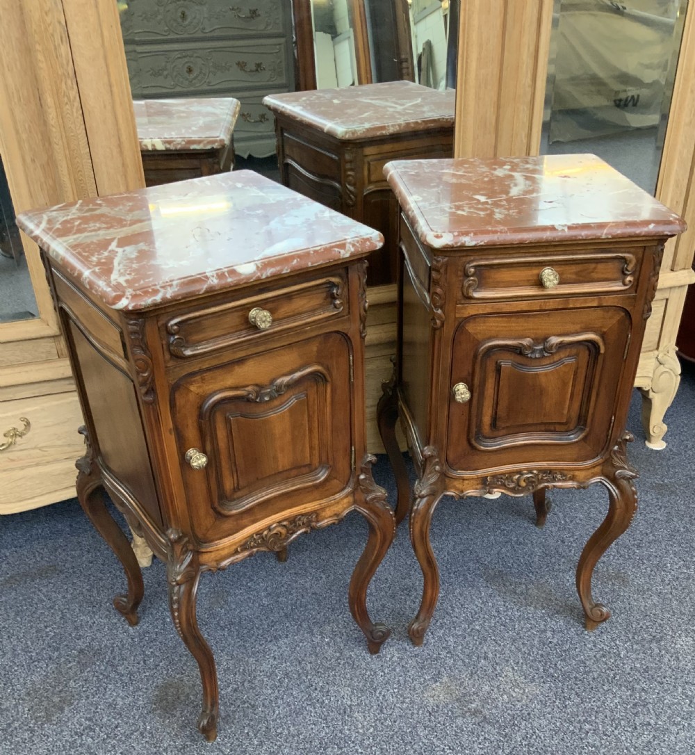 pair of carved walnut french bedside cabinets