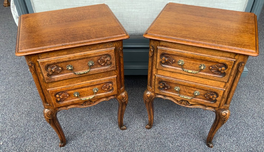 pair of carved oak french bedside cabinets
