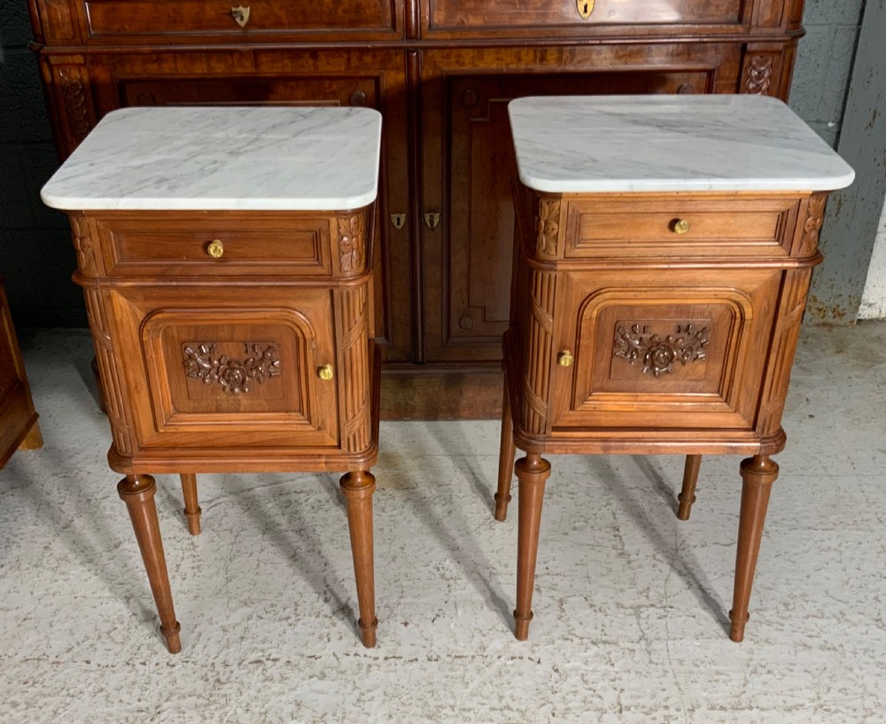 pair of french marble topped bedside cabinets